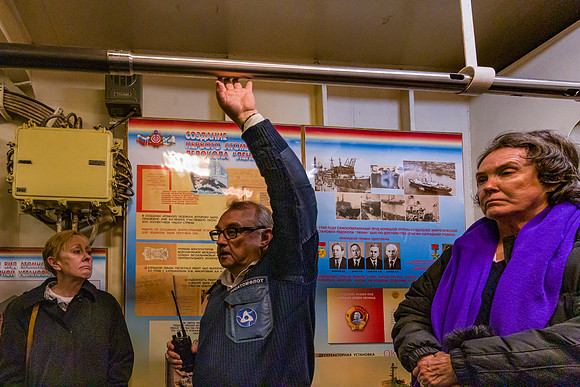 An Engineer Points out a hopefully  inert nuclear fuel rod.